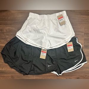 BRAND NEW WITH TAGS. 3 PAIRS WOMEN’S DRI-FIT TEMPO RUNNING SHORTS. SIZE L.